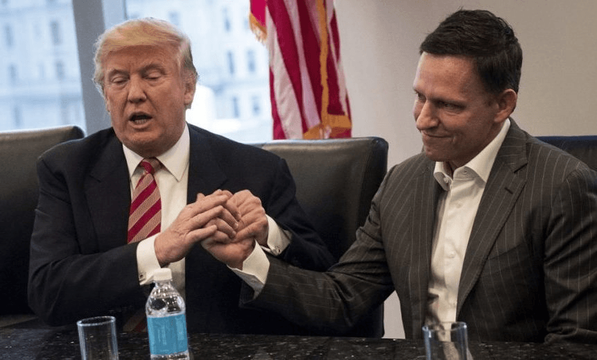 NEW YORK, NY – DECEMBER 14: (L to R) Vice President-elect Mike Pence looks on as President-elect Donald Trump shakes the hand of Peter Thiel during a meeting with technology executives at Trump Tower, December 14, 2016 in New York City. This is the first major meeting between President-elect Trump and technology industry leaders. (Photo by Drew Angerer/Getty Images) 
