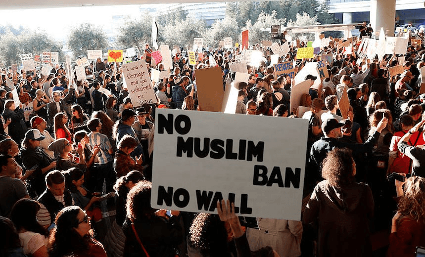 Demonstrators block traffic at the San Francisco Airport international arrival terminal as they protest against the Muslim immigration ban on January 28, 2017. President Donald Trump signed an executive order on Friday that suspends entry of all refugees for 120 days, indefinitely suspends the entries of all Syrian refugees, as well as barring entries from seven predominantly Muslim countries from entering for 90 days. (Photo by Stephen Lam/Getty Images) 
