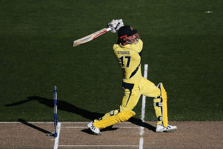 Marcus Stoinis swings out. (Photo by Anthony Au-Yeung/Getty Images)