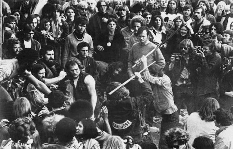 A still from the documentary film 'Gimme Shelter', showing audience members looking on as Hells Angels beat a fan with pool cues at the Altamont Free Concert, 1969. (Photo by Bill Owens/20th Century Fox/Hulton Archive/Getty Images)
