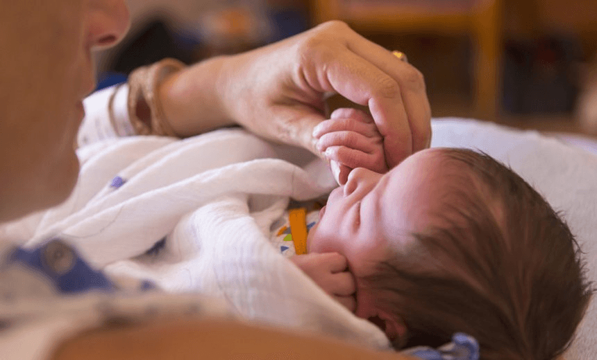 mother holding newborn baby