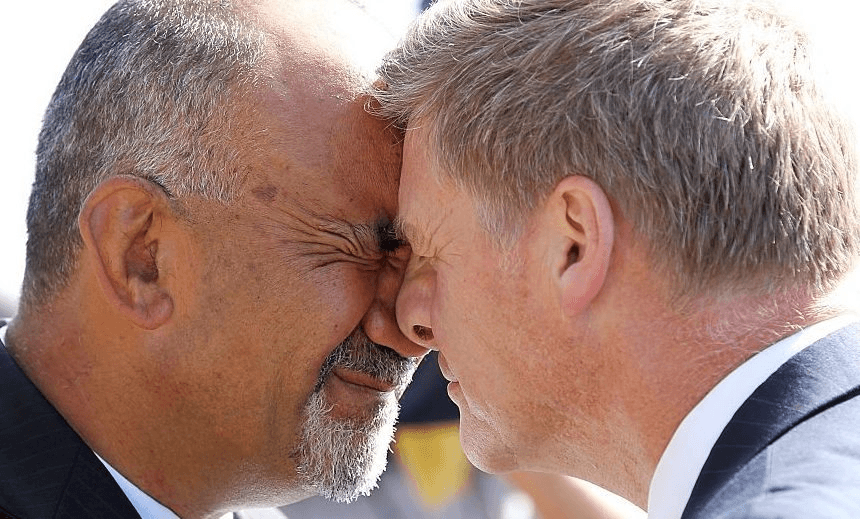 PAIHIA, NEW ZEALAND – FEBRUARY 05:  Maori Party co-leader Te Ururoa Flavell and Deputy Leader of the National Party Bill English hongi at the Te Tii Waitangi Marae on February 5, 2015 in Paihia, New Zealand.  The Waitangi Day national holiday celebrates the signing of the treaty of Waitangi on February 6, 1840 by Maori chiefs and the British Crown, that granted the Maori people the rights of British Citizens and ownership of their lands and other properties. (Photo by Michael Bradley/Getty Images) 

