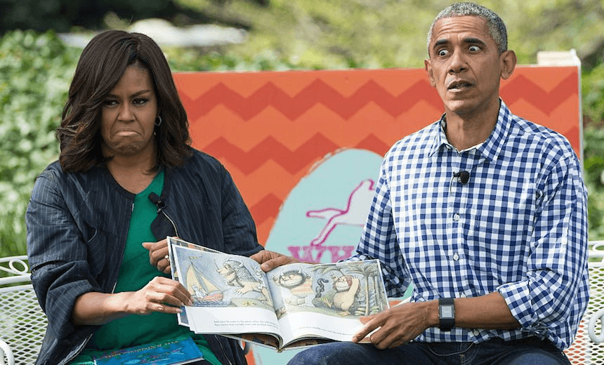 TOPSHOT – US President Barack Obama and First Lady Michelle Obama read Maurice Sendak’s “Where the Wild Things Are” to children at the annual Easter Egg Roll at the White House in Washington, DC, on March 28, 2016. 
Some 35,000 guests have been invited to participate in the 138th annual Easter Egg roll. The theme of the day’s event is Let’s Celebrate!  / AFP / Nicholas Kamm        (Photo credit should read NICHOLAS KAMM/AFP/Getty Images) 
