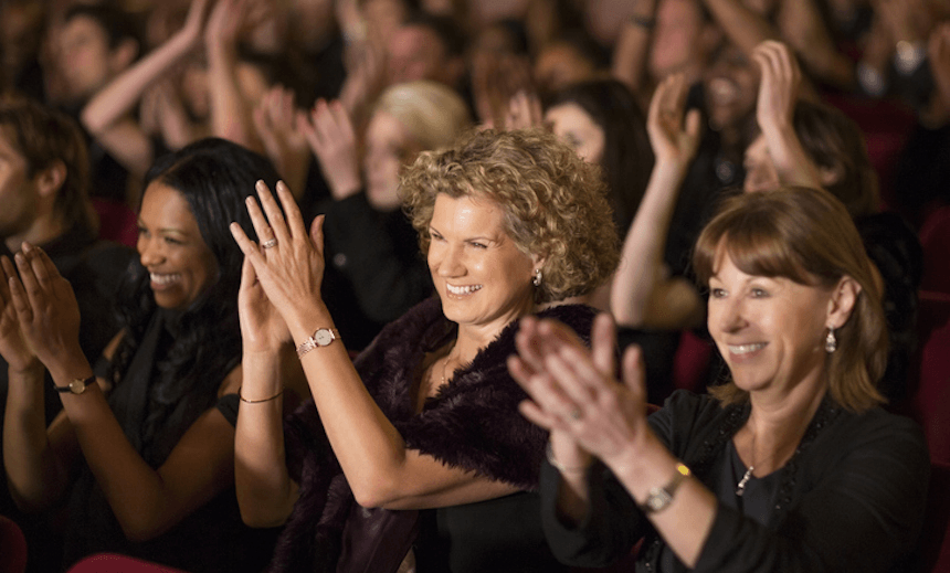 Clapping theater audience 
