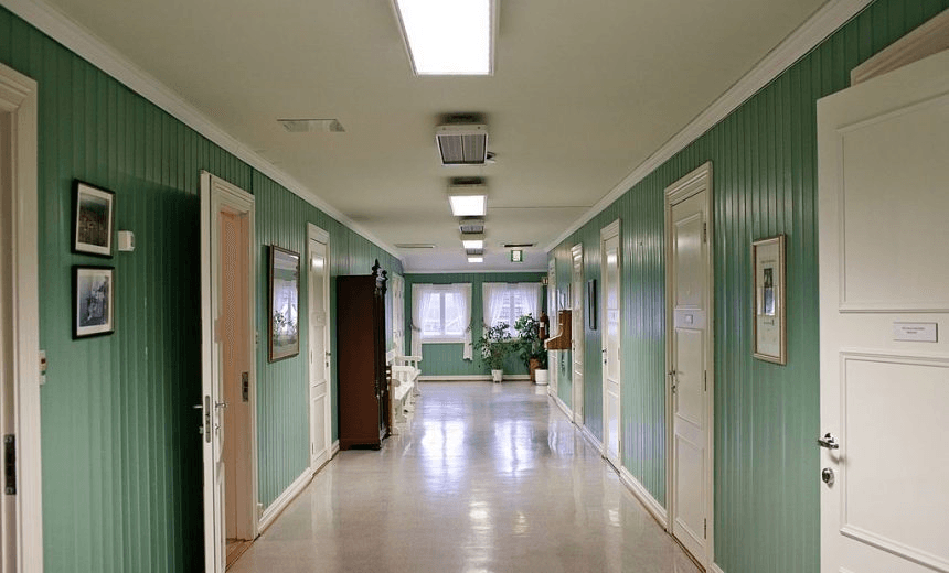 BASTOY ISLAND, HORTEN, NORWAY – APRIL 12:  The corridor of the wooden cottages that host the prison administration’s offices is seen in Bastoy Prison on April 12, 2011 in Bastoy Island, Horten, Norway. Bastoy Prison is a minimum security prison located on Bastoy Island, Norway, about 75 kilometers (46 mi) south of Oslo. The facility is located on a 2.6 square kilometer (1 sq mi) island and hosts 115 inmates. Arne Kvernvik Nilsen, governor of the prison, leads a staff of about 70 prison employees. Of this staff, only five employees remain on the island overnight.  Once a prison colony for young boys, the facility now is trying to become “the first eco-human prison in the world.” Inmates are housed in wooden cottages and work the prison farm. During their free time, inmates have access to horseback riding, fishing, tennis, and cross-country skiing. (Photo by Marco Di Lauro/Reportage by Getty Images) 
