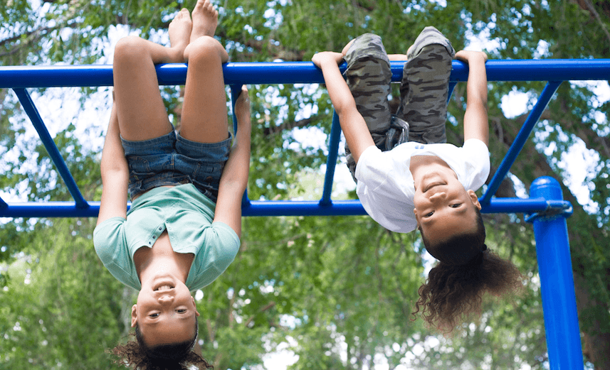 Two Girls Hanging Upside Down