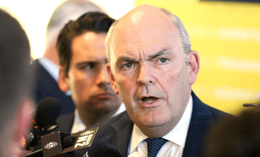 Finance Minister Steven Joyce speaks to media while Transport Minister Simon Bridges looks on, April 27, 2017 (Photo by Hagen Hopkins/Getty Images) 
