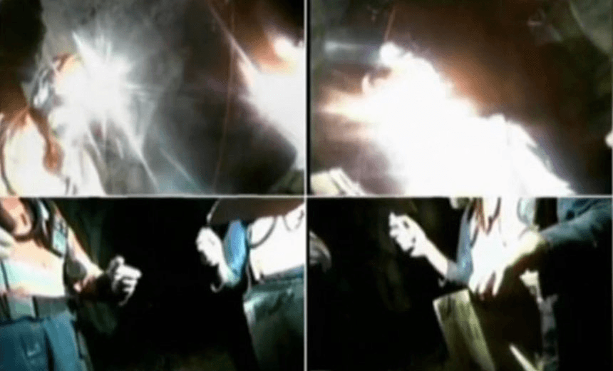 The footage, screened by Newshub, showing two men adjusting a robot in the drift in 2011. Grab: Newshub