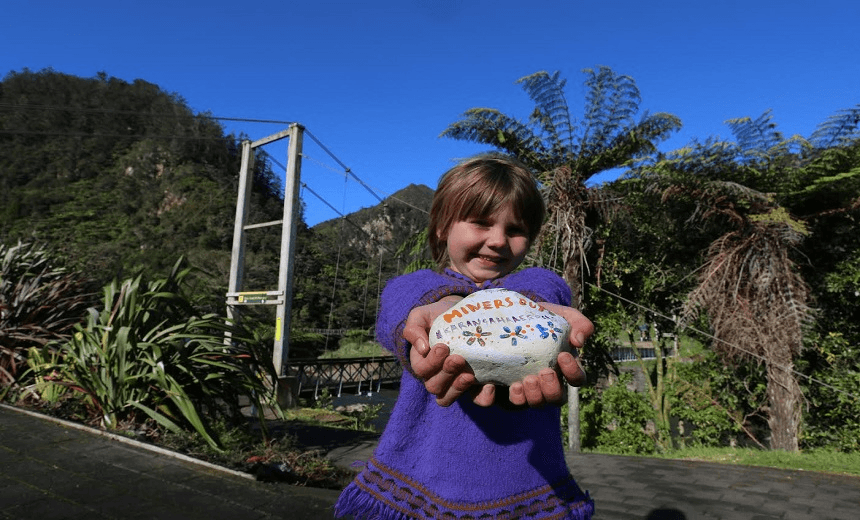 Ramona with one of her Protect the Mountain rocks 
