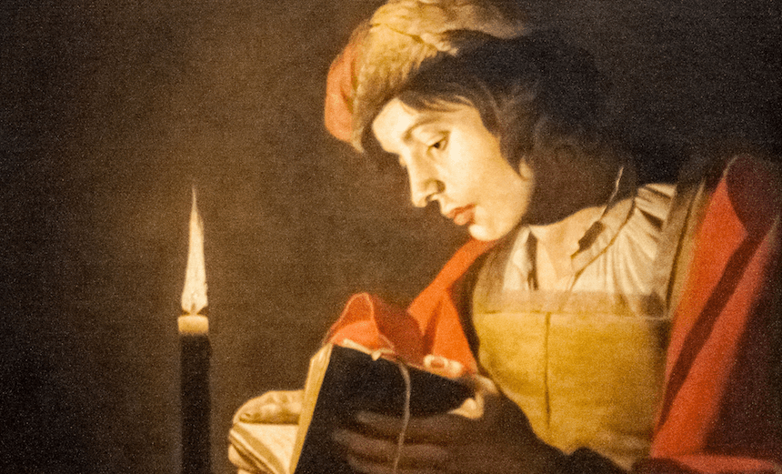 Stom_-_A_Young_Man_Reading_at_Candlelight