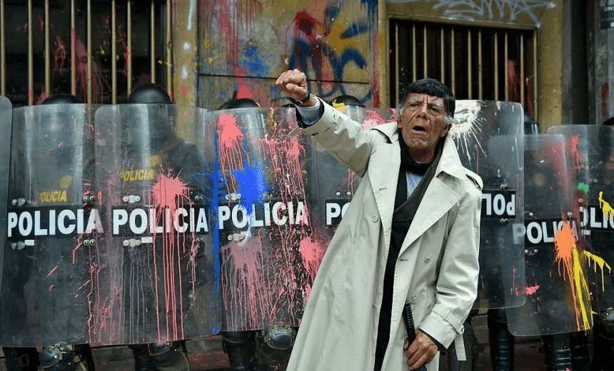 Activists protest in Bogota, on March 17, 2016 as part of a national strike organized by labor unions to protest against the economic and social policies of President Juan Manuel Santos. AFP PHOTO / GUILLERMO LEGARIA / AFP / GUILLERMO LEGARIA        (Photo credit should read GUILLERMO LEGARIA/AFP/Getty Images) 
