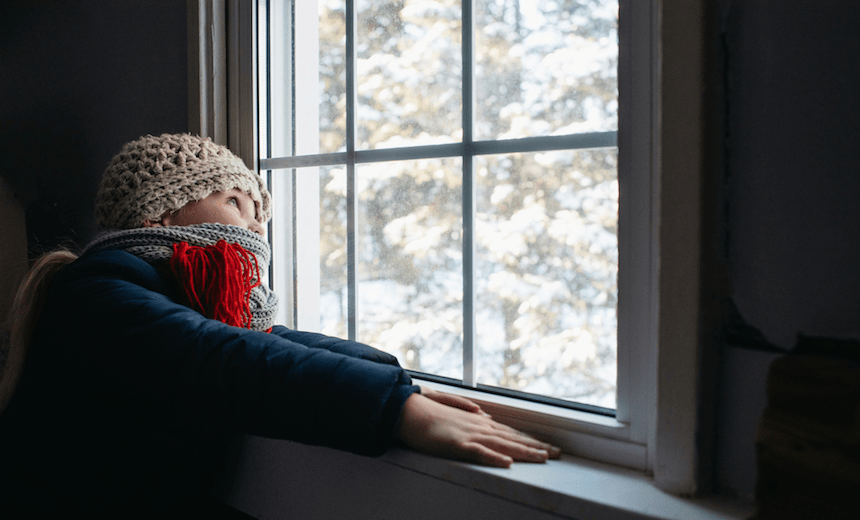 Girl looking out of window 
