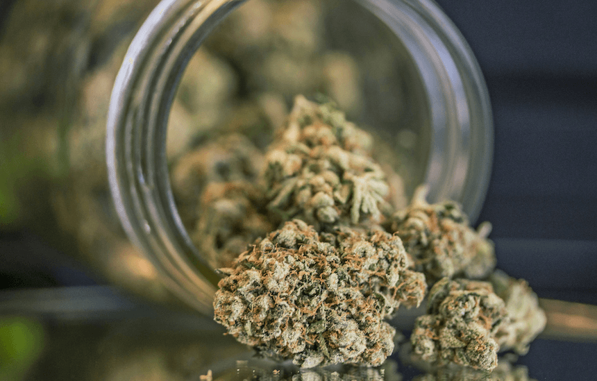Close-Up Of Weed In Mason Jar On Table