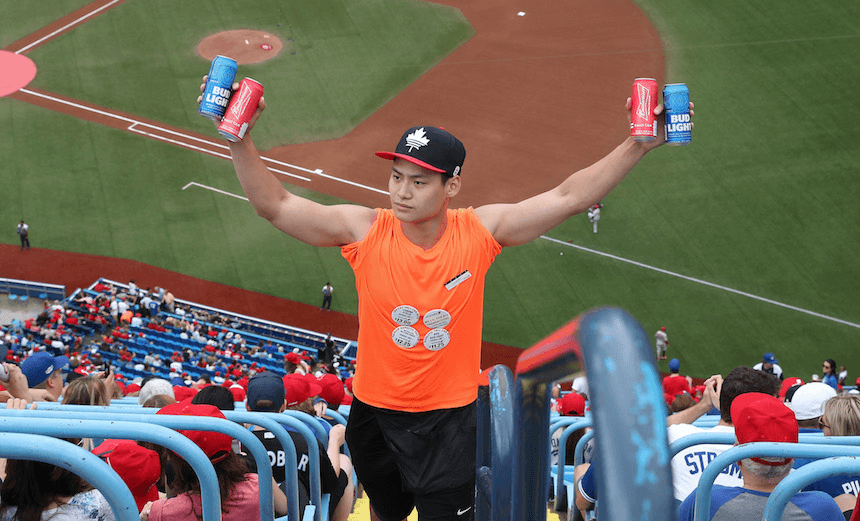 TORONTO, ON – JULY 1: A beer vendor sells beer in the upper deck before the start of the Toronto Blue Jays MLB game against the Boston Red Sox at Rogers Centre on July 1, 2017 in Toronto, Canada. (Photo by Tom Szczerbowski/Getty Images) *** Local Caption *** 
