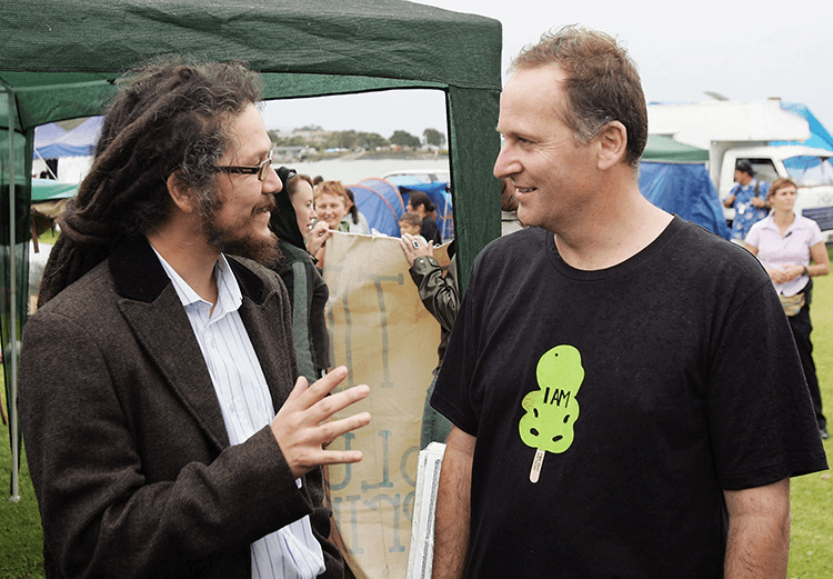 WAITANGI, NEW ZEALAND – FEBRUARY 05:  National Party leader John Key (R) talks with Green MP Nandor Tanczos (L) as he walks around the lower Te Tii Marae on the eve of Waitangi Day celebrations February 05, 2007 in Waitangi, New Zealand. Waitangi Day is a public holiday celebrated on February 6th to commemorate the signing of the Treaty of Waitangi between the British and the Maori people.  (Photo by Phil Walter/Getty Images) 

