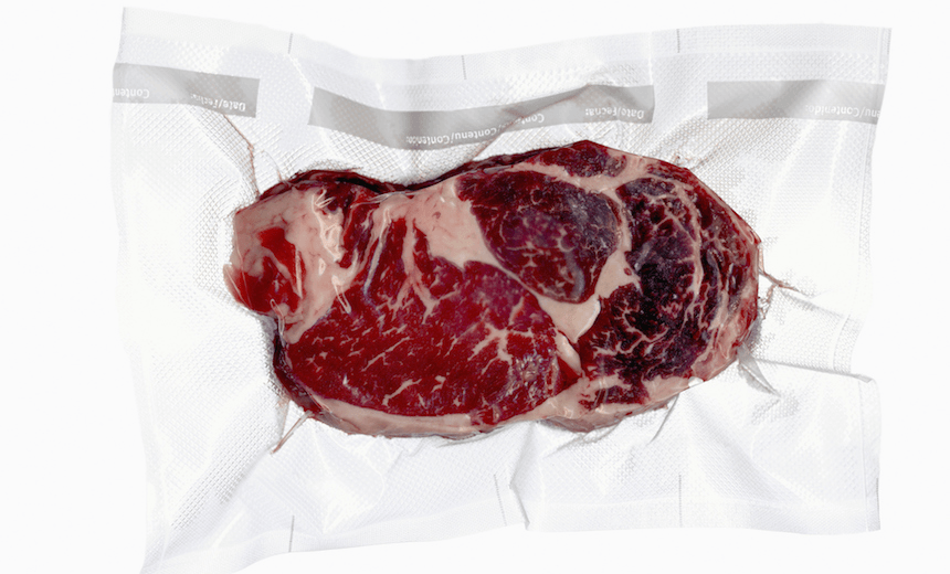 Vacuum sealed frozen cut of beef
