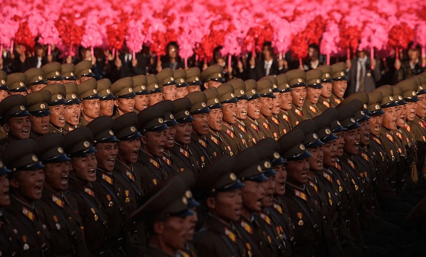 North Korean soldiers march during a mass military parade at Kim Il-Sung square in Pyongyang on October 10, 2015. North Korea was marking the 70th anniversary of its ruling Workers’ Party. AFP PHOTO / Ed Jones        (Photo credit should read ED JONES/AFP/Getty Images) 
