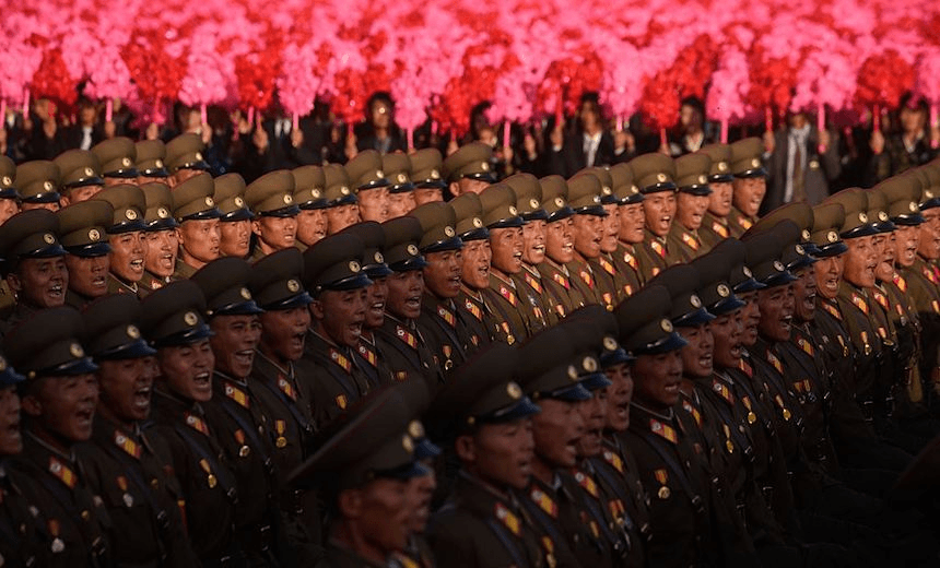 North Korean soldiers march during a mass military parade at Kim Il-Sung square in Pyongyang on October 10, 2015. North Korea was marking the 70th anniversary of its ruling Workers’ Party. AFP PHOTO / Ed Jones (Photo credit should read ED JONES/AFP/Getty Images)
