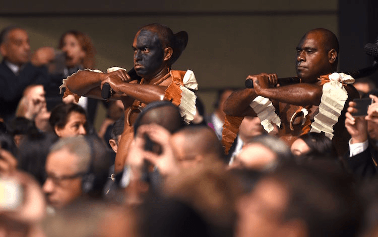 Members of a Fijian culture group perform during the opening session of the COP23 United Nations Climate Change Conference on November 6, 2017 in Bonn, Germany. 
Image: PATRIK STOLLARZ/AFP/Getty Images 
