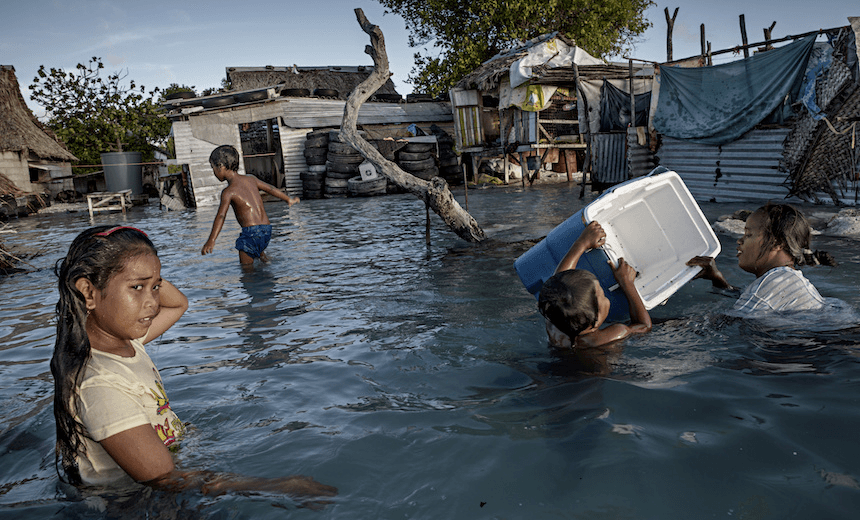 Flooding in the village of Eita, Kiribati, 2015.  Kiribati’s future generations are at risk of potentially lethal sea level rise (Photo: Jonas Gratzer/LightRocket via Getty Images) 
