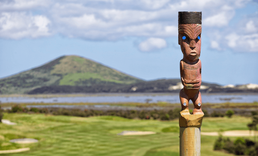 Pouwhenua or pou whenua, carved wooden Maori posts on an Northland golf course, New Zealand 
