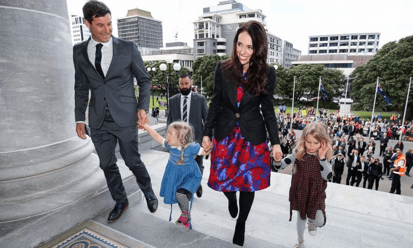 Prime Minister Jacinda Ardern and partner Clarke Gayford with Gayford’s nieces at Parliament after a swearing-in ceremony in October (Photo by Hagen Hopkins/Getty Images) 
