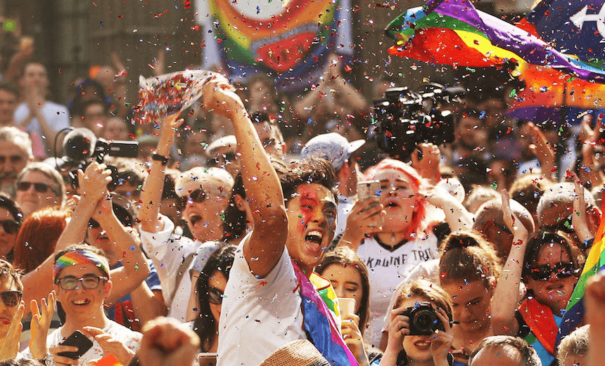 MELBOURNE, AUSTRALIA – NOVEMBER 15:  People in the crowd celebrate as the result is announced during the Official Melbourne Postal Survey Result Announcement at the State Library of Victoria on November 15, 2017 in Melbourne, Australia. Australians have voted for marriage laws to be changed to allow same-sex marriage, with the Yes vote defeating No. Despite the Yes victory, the outcome of Australian Marriage Law Postal Survey is not binding, and the process to change current laws will move to the Australian Parliament in Canberra.  (Photo by Scott Barbour/Getty Images) 
