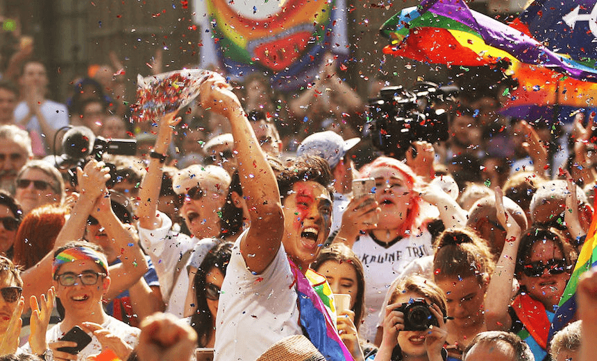 MELBOURNE, AUSTRALIA – NOVEMBER 15: People in the crowd celebrate as the result is announced during the Official Melbourne Postal Survey Result Announcement at the State Library of Victoria on November 15, 2017 in Melbourne, Australia. Australians have voted for marriage laws to be changed to allow same-sex marriage, with the Yes vote defeating No. Despite the Yes victory, the outcome of Australian Marriage Law Postal Survey is not binding, and the process to change current laws will move to the Australian Parliament in Canberra. (Photo by Scott Barbour/Getty Images)