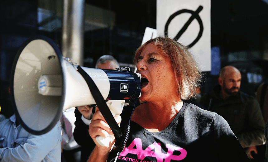 AUCKLAND, NEW ZEALAND – MAY 16: Former Green MP Sue Bradford protests at the Sky City Convention Centre on May 16, 2014 in Auckland, New Zealand. (Photo by Hannah Peters/Getty Images) 
