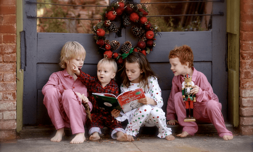 Children reading Dr Seuss&#8217; The Grinch at Christmas