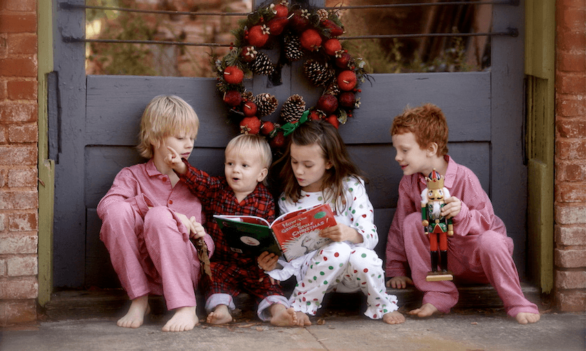 Children reading Dr Seuss’ The Grinch at Christmas