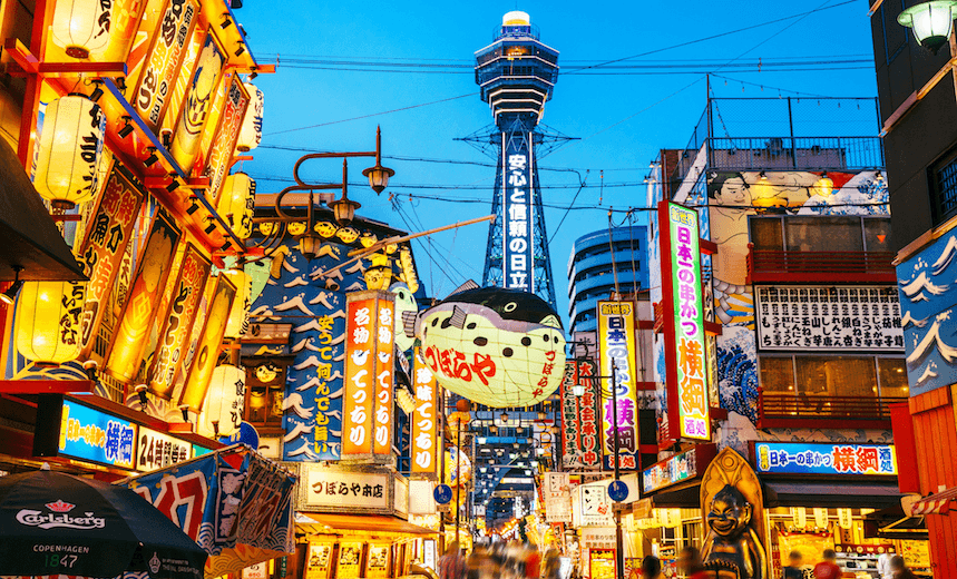 Osaka Tower and view of the neon advertisements Shinsekai district 
