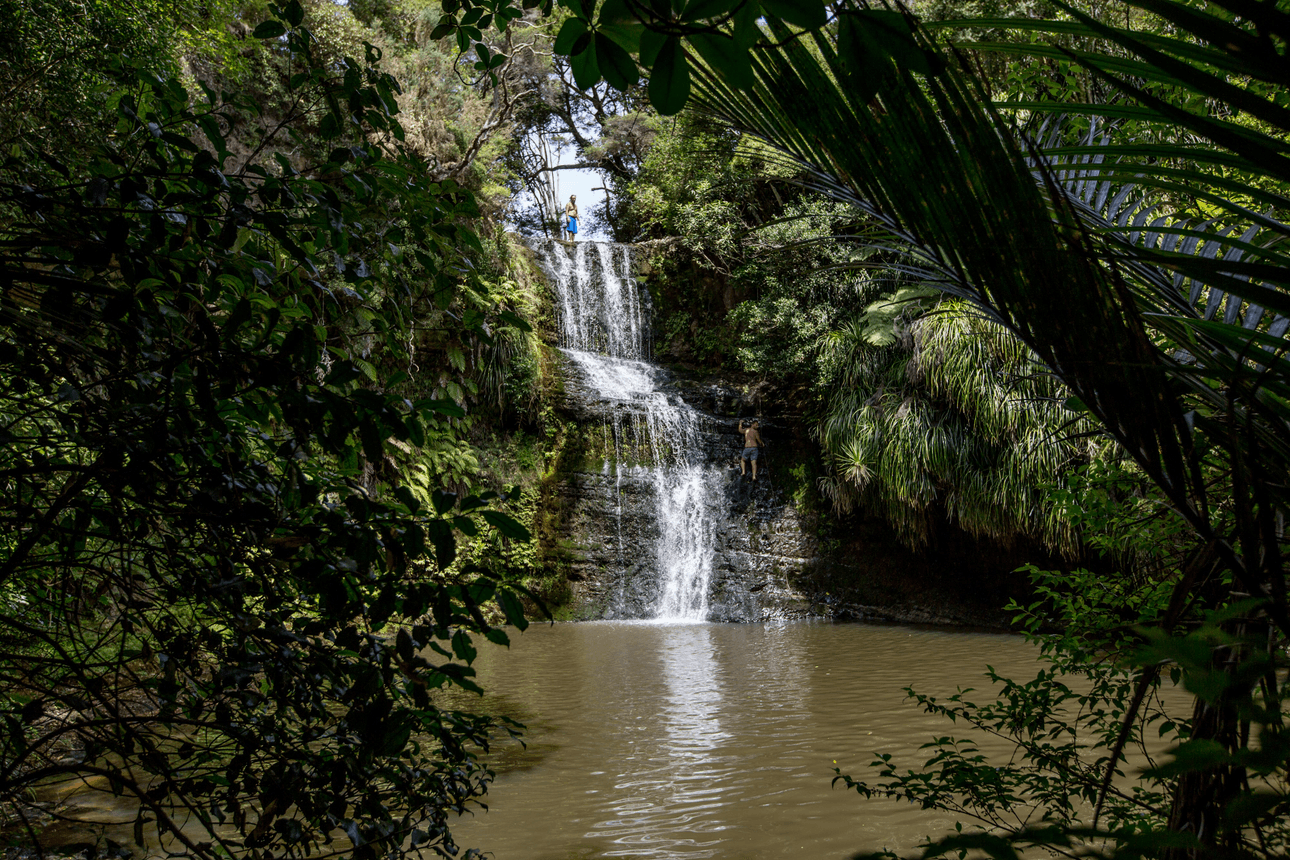 The resident adrenaline junkies worked their way up the waterfall. (Photo: Andy Day) 
