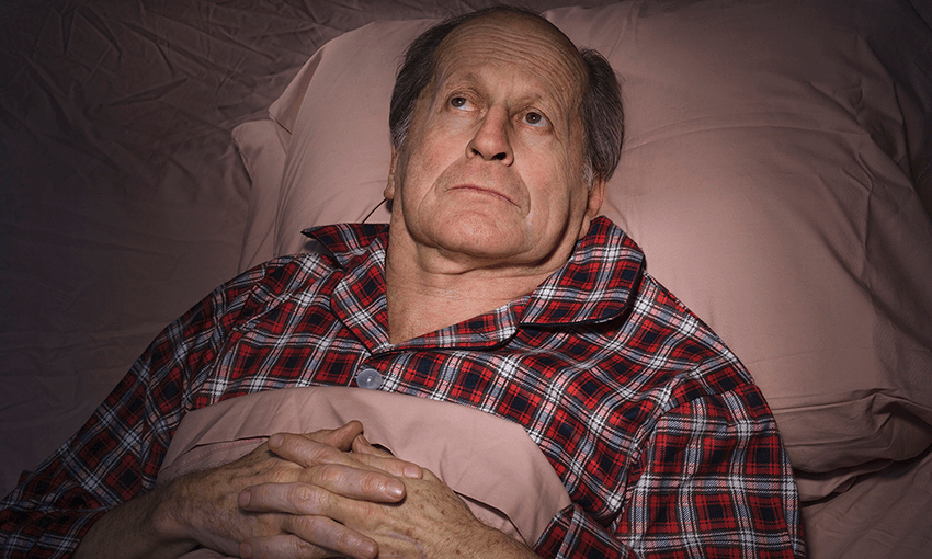 Senior Caucasian man having trouble sleeping