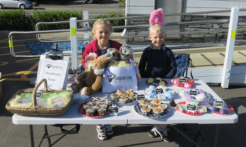 Ava Rose Heath-Williams and her little brother Matthew selling Dancing Owl Soaps at the Rolleston Market.