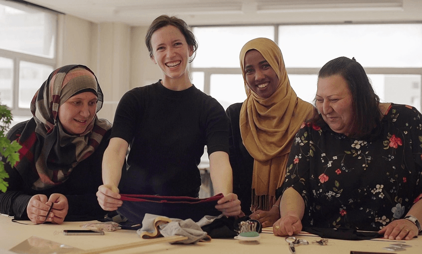Elisha Watson (second to left) bonded with resettled women over their shared love of sewing. (supplied) 
