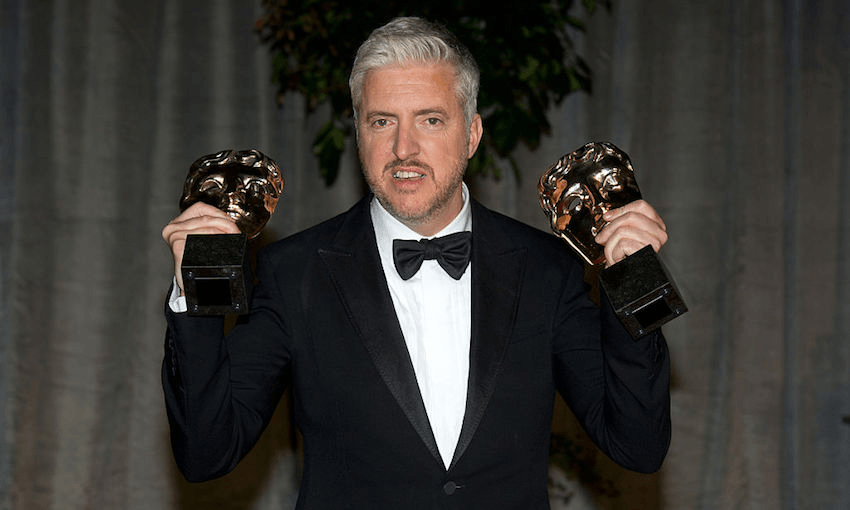 Anthony McCarten with his two BAFTAs (Photo by Zak Hussein/Corbis via Getty Images) 

