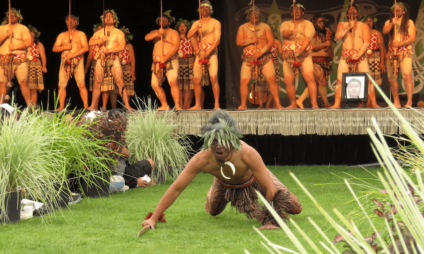 Wero is a competition category in the senior kapa haka at Te Hui Ahurei a Tūhoe. The kaiwero for Te Waimana Kaaku mimics a lizard as he approaches. Waimana will host the Ahurei in 2020. Image: Jason Renes 
