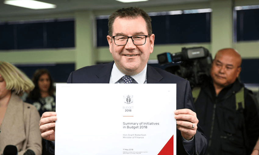 Finance Minister Grant Robertson holds a copy of the Budget 2018 Summary of Initiatives cover during a photo opportunity at Printlink on May 15, 2018 in Wellington, New Zealand. Budget 2018 will be delivered on Thursday, 17 May.  (Photo by Hagen Hopkins/Getty Images) 
