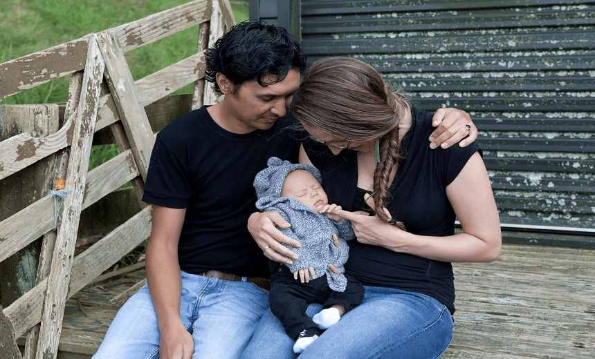 The author, her partner and their child 
