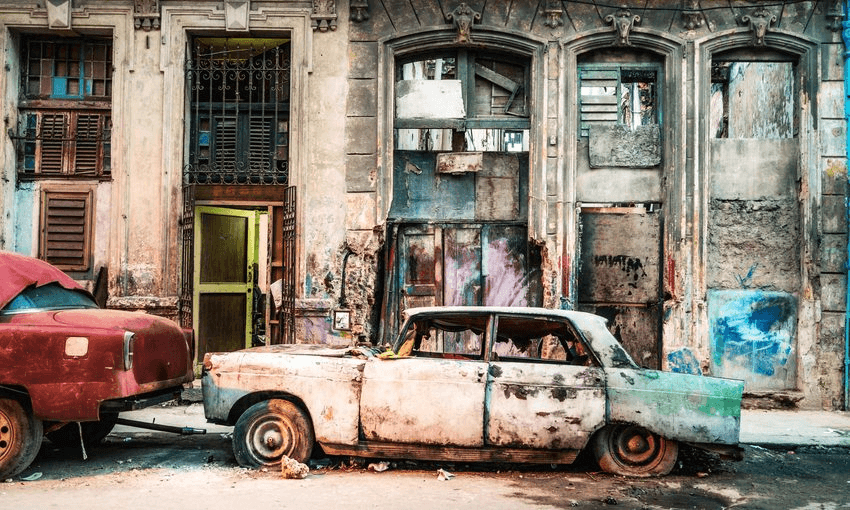 Old damaged vintage Car on the street of old Havana, Cuba