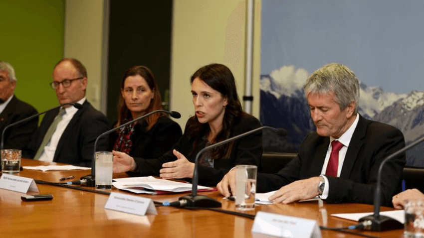 PM Jacinda Ardern, agriculture minister Damien O’Connor, and industry representatives announcing the plan to eradicate mycoplasma bovis (Radio NZ: Rebekah Parsons–King)  
