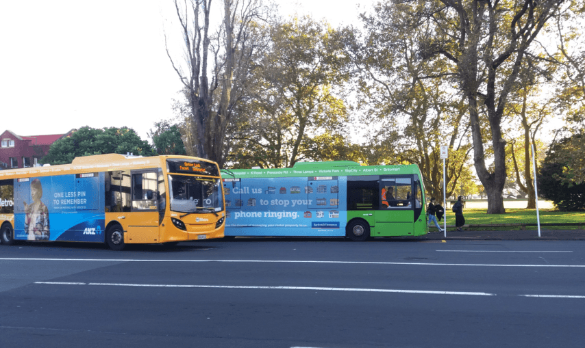 An Outer Link bus overtaking an Inner Link bus stopped at Victoria Park (Alex Braae)  
