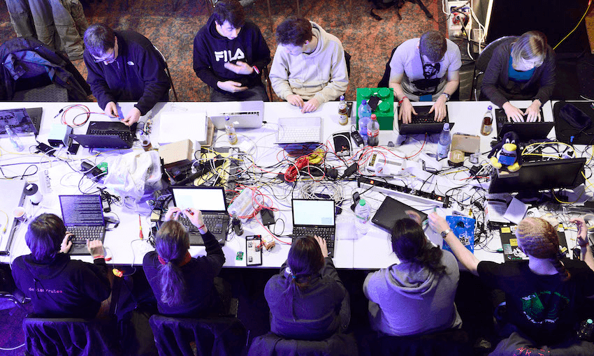 Participants work at their laptops at the annual Chaos Computer Club (CCC) computer hackers’ congress, called in Hamburg, Germany. (Photo by Patrick Lux/Getty Images) 
