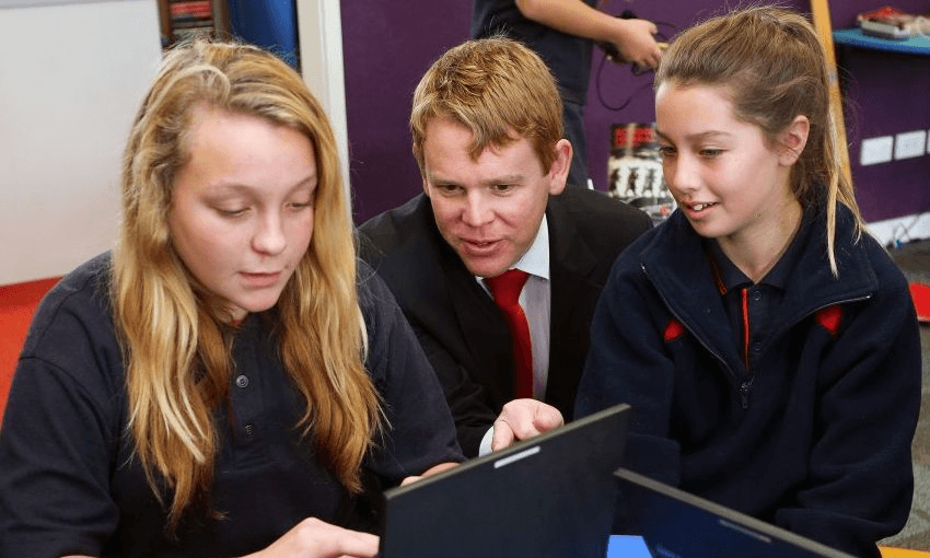 Education minister (then opposition spokesperson) Chris Hipkins speaks to students at Fergusson Intermediate in, 2014. Photo by Hagen Hopkins/Getty Images 
