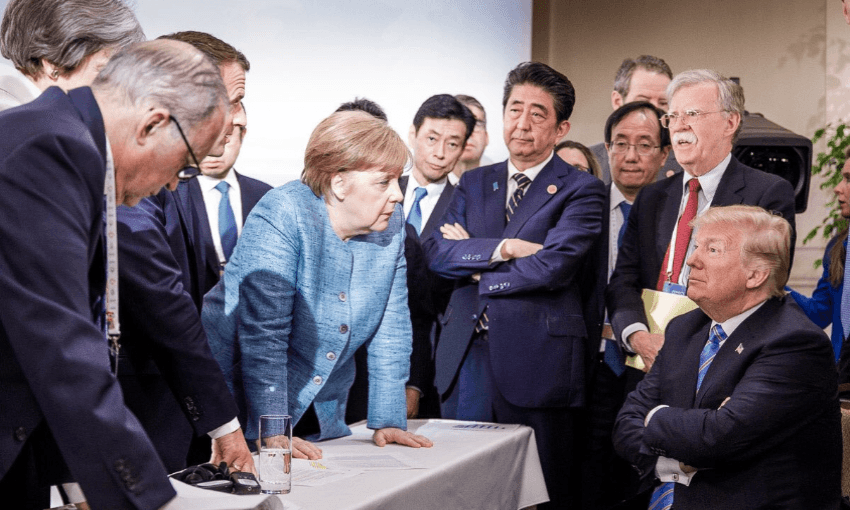 A photo released by the German government that about sums up the state of the US relationship to the rest of the world. (Photographer: Jesco Denzel) 
