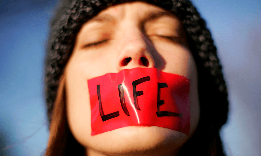Pro-life activist Lynn Jackson, with the group Bound for Life, protests in front of the U.S. Supreme Court November 30, 2005 in Washington, DC. (Photo by Win McNamee/Getty Images) 
