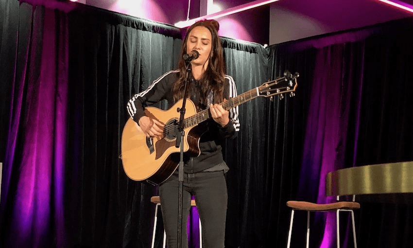 Amy Shark performing her acoustic set at S @ Spark Arena on July 2 (Image: Lydia Burgham) 
