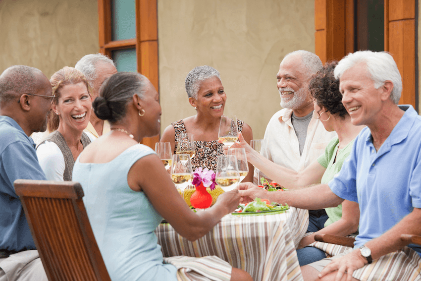 Friends having dinner party on patio