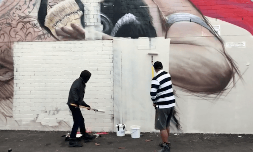 Graffiti artist Mr G painting over his mural of Tauranga Moana leader Awanui Black. Image: Mr G Hoete Art 
